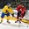 GRAND FORKS, NORTH DAKOTA - APRIL 18: Switzerland's Tobias Greisser #20 and Sweden's Tim Wahlgren #22 battle for the puck during preliminary round action at the 2016 IIHF Ice Hockey U18 World Championship. (Photo by Minas Panagiotakis/HHOF-IIHF Images)

